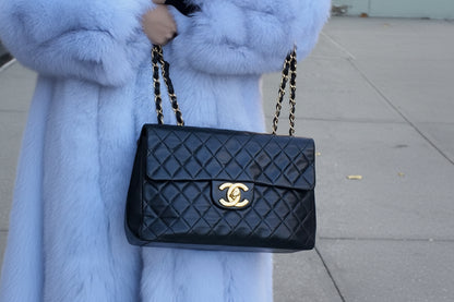 1990s Chanel Jumbo Classic Flap in Black Lambskin with 24kt gold plated hardware.