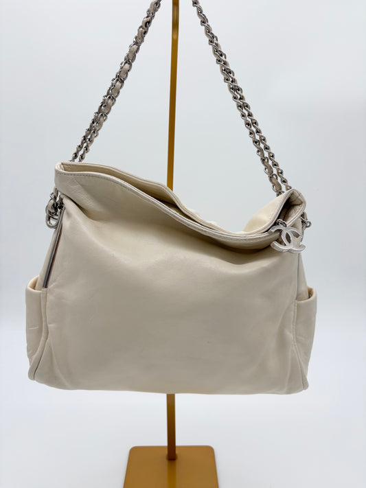 Vintage Chanel off white hobo bag with silver hardware.
