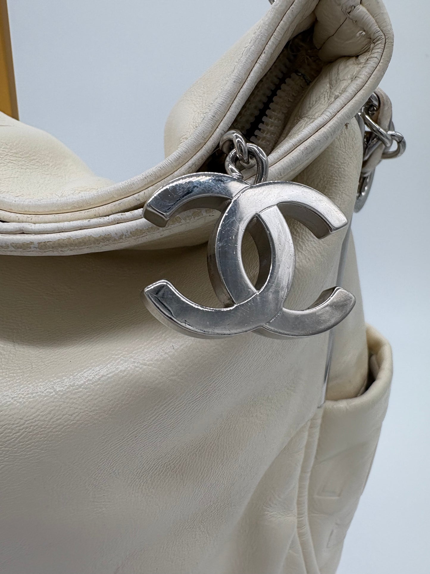Vintage Chanel off white hobo bag with silver hardware.