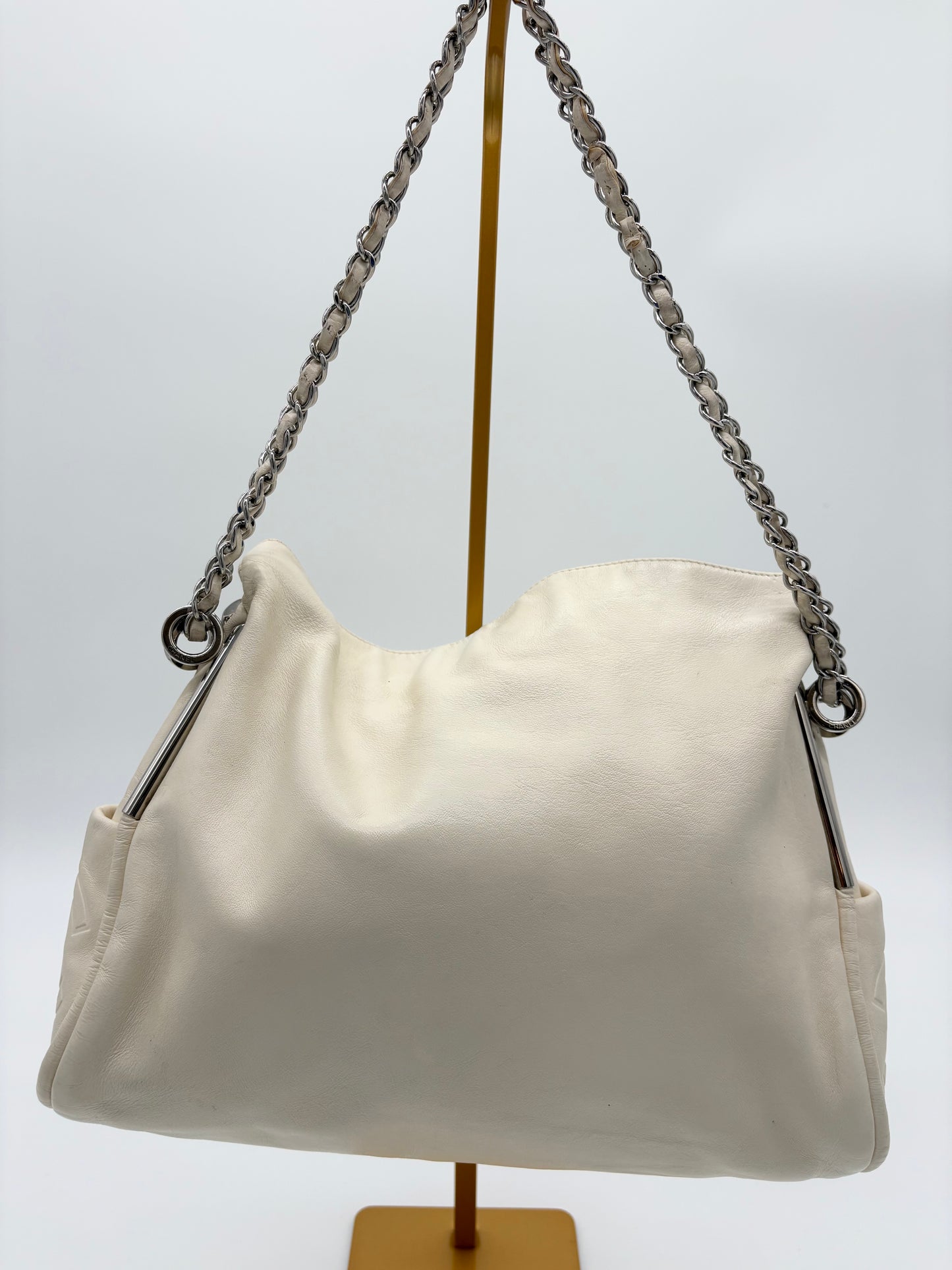 Vintage Chanel off white hobo bag with silver hardware.