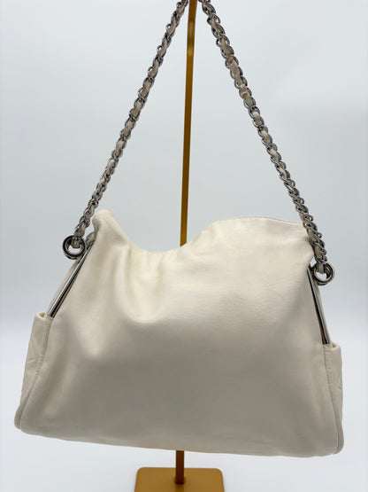 Vintage Chanel off white hobo bag with silver hardware.