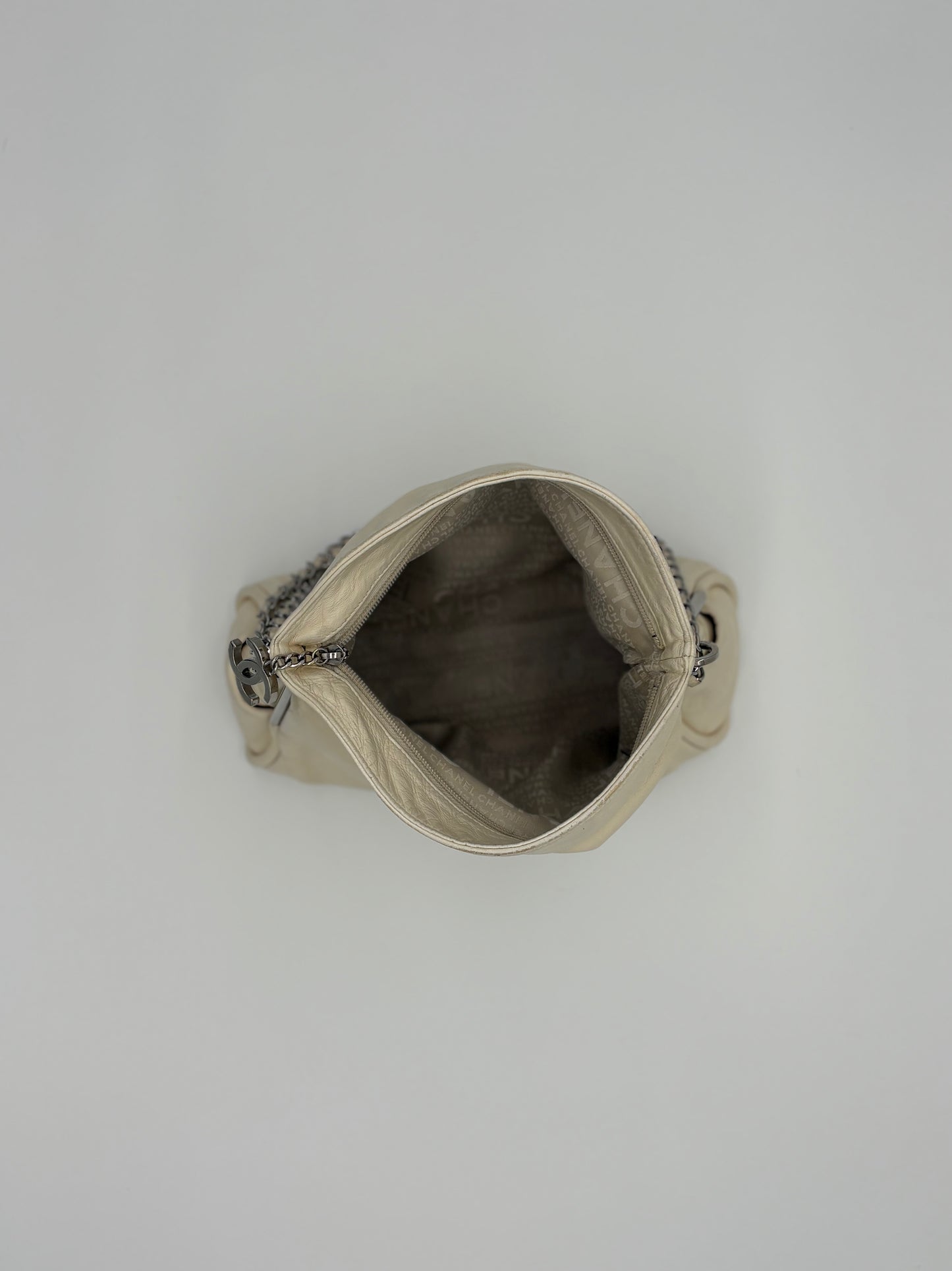 Vintage Chanel off white hobo bag with silver hardware.