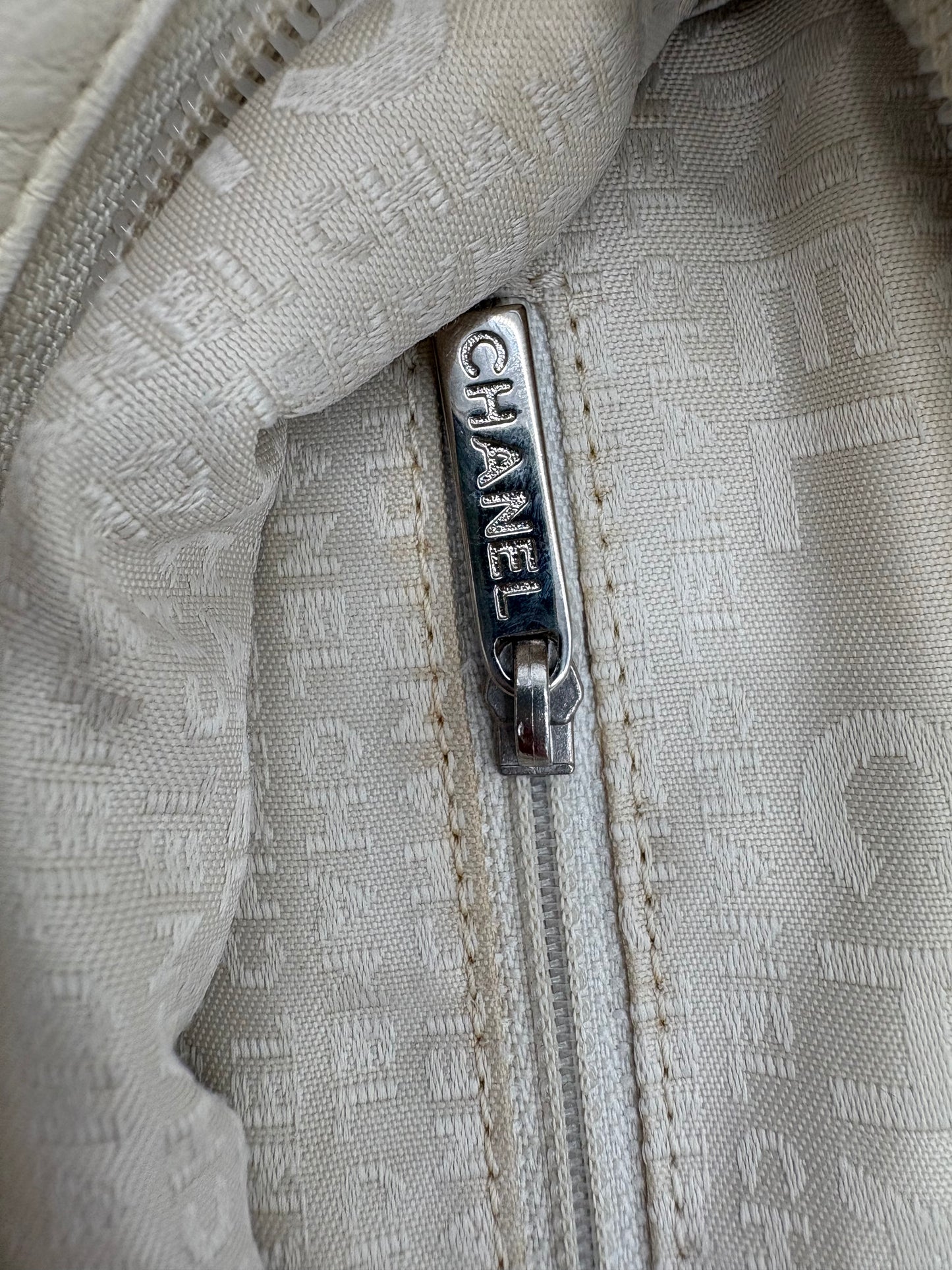 Vintage Chanel off white hobo bag with silver hardware.