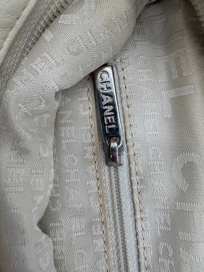 Vintage Chanel off white hobo bag with silver hardware.