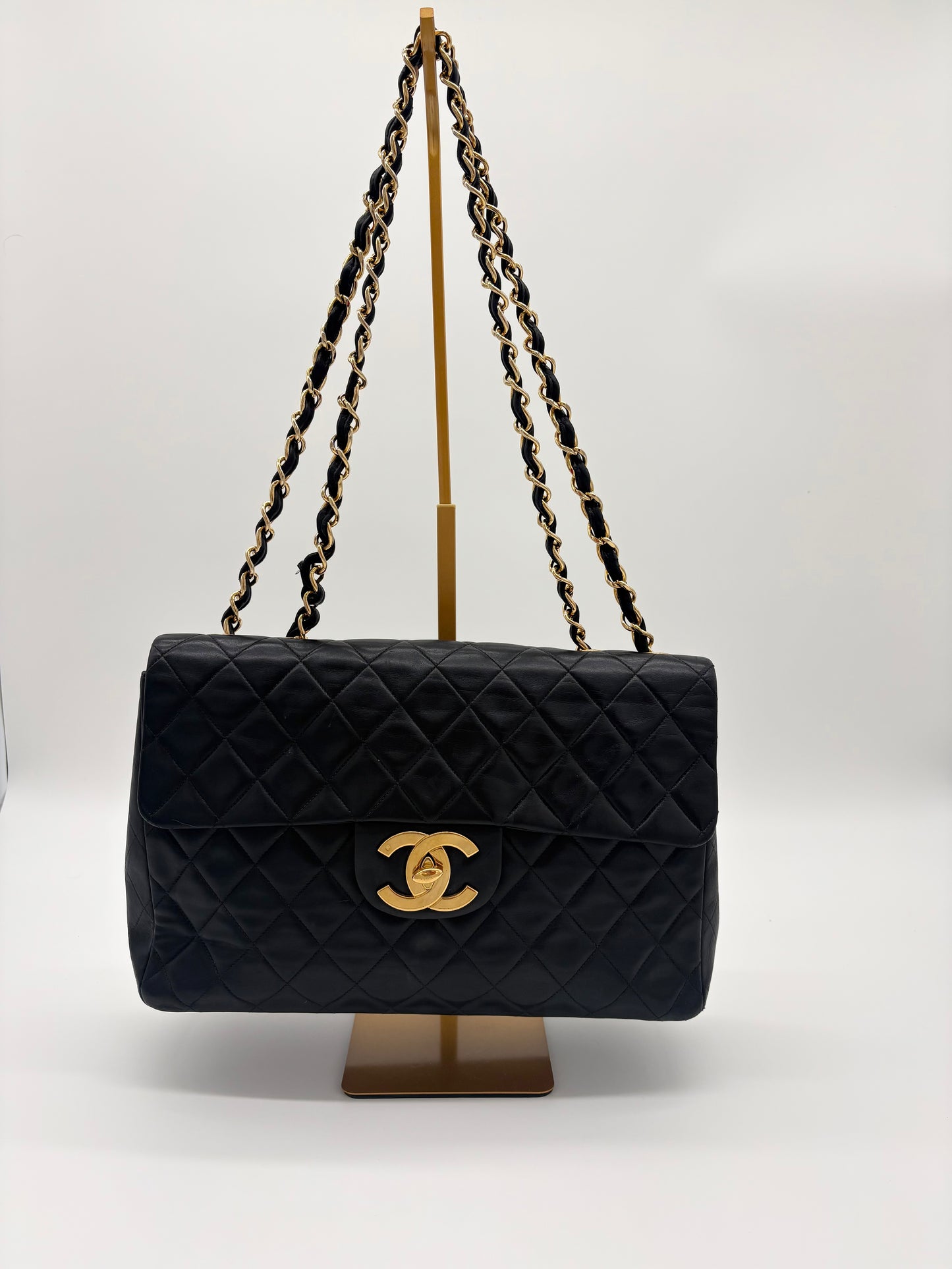 1990s Chanel Jumbo Classic Flap in Black Lambskin with 24kt gold plated hardware.