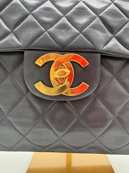 1990s Chanel Jumbo Classic Flap in Black Lambskin with 24kt gold plated hardware.