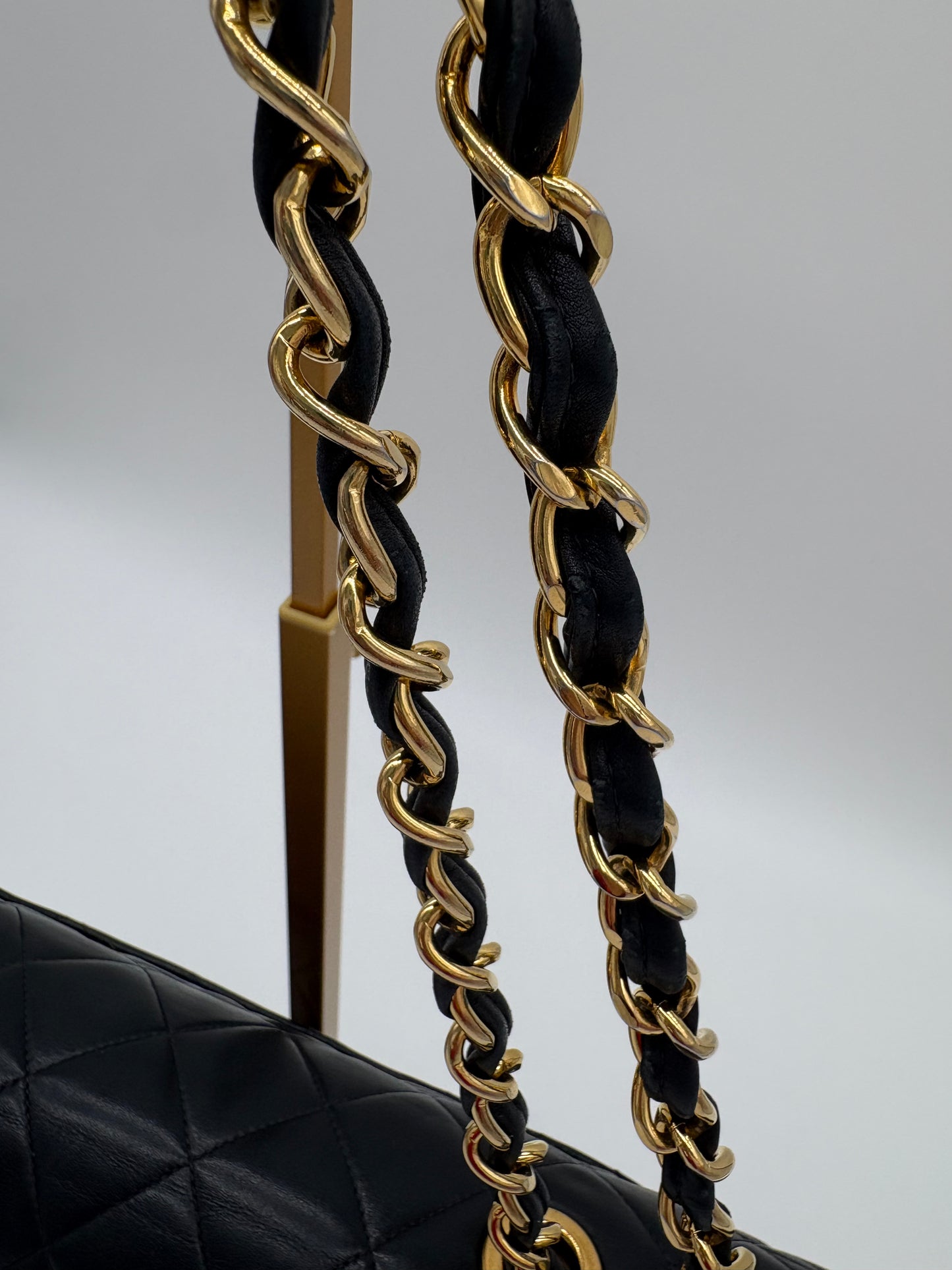 1990s Chanel Jumbo Classic Flap in Black Lambskin with 24kt gold plated hardware.