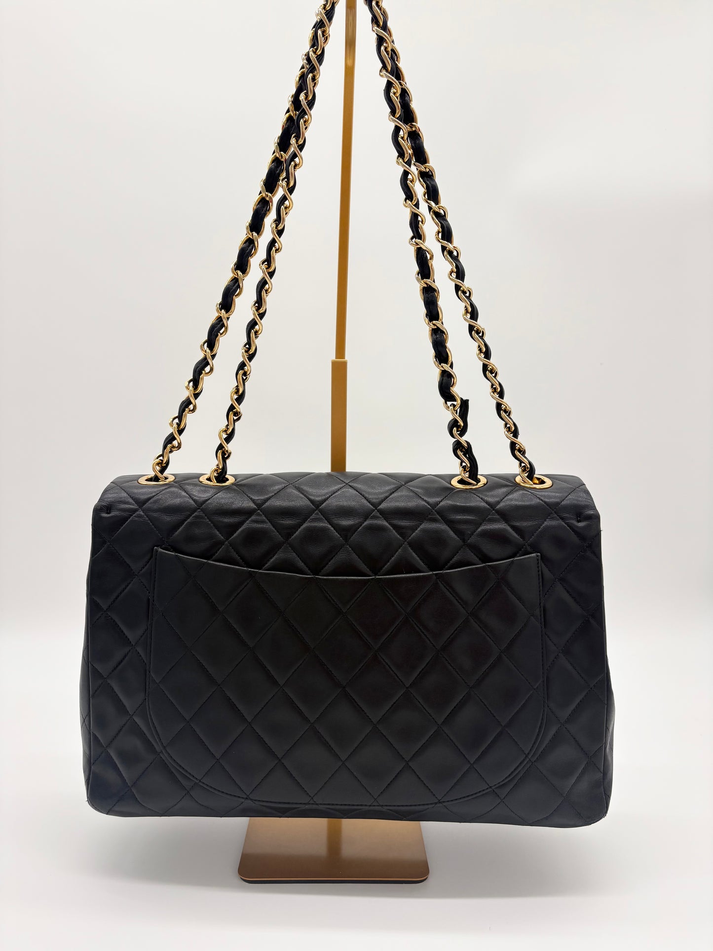 1990s Chanel Jumbo Classic Flap in Black Lambskin with 24kt gold plated hardware.