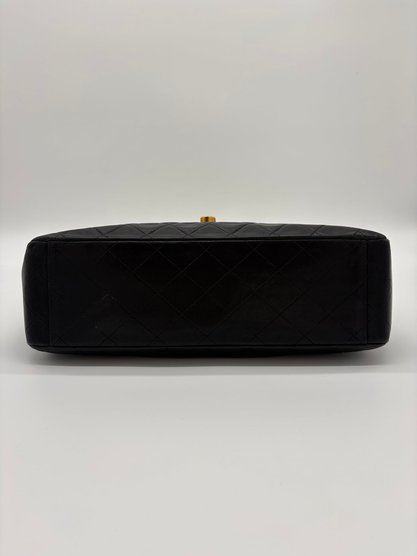 1990s Chanel Jumbo Classic Flap in Black Lambskin with 24kt gold plated hardware.