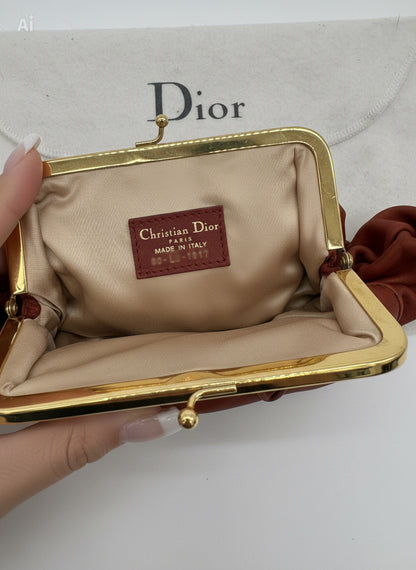 Christian Dior Burnt Orange Lambskin Kiss Lock Clutch with Gold Hardware and Charm.